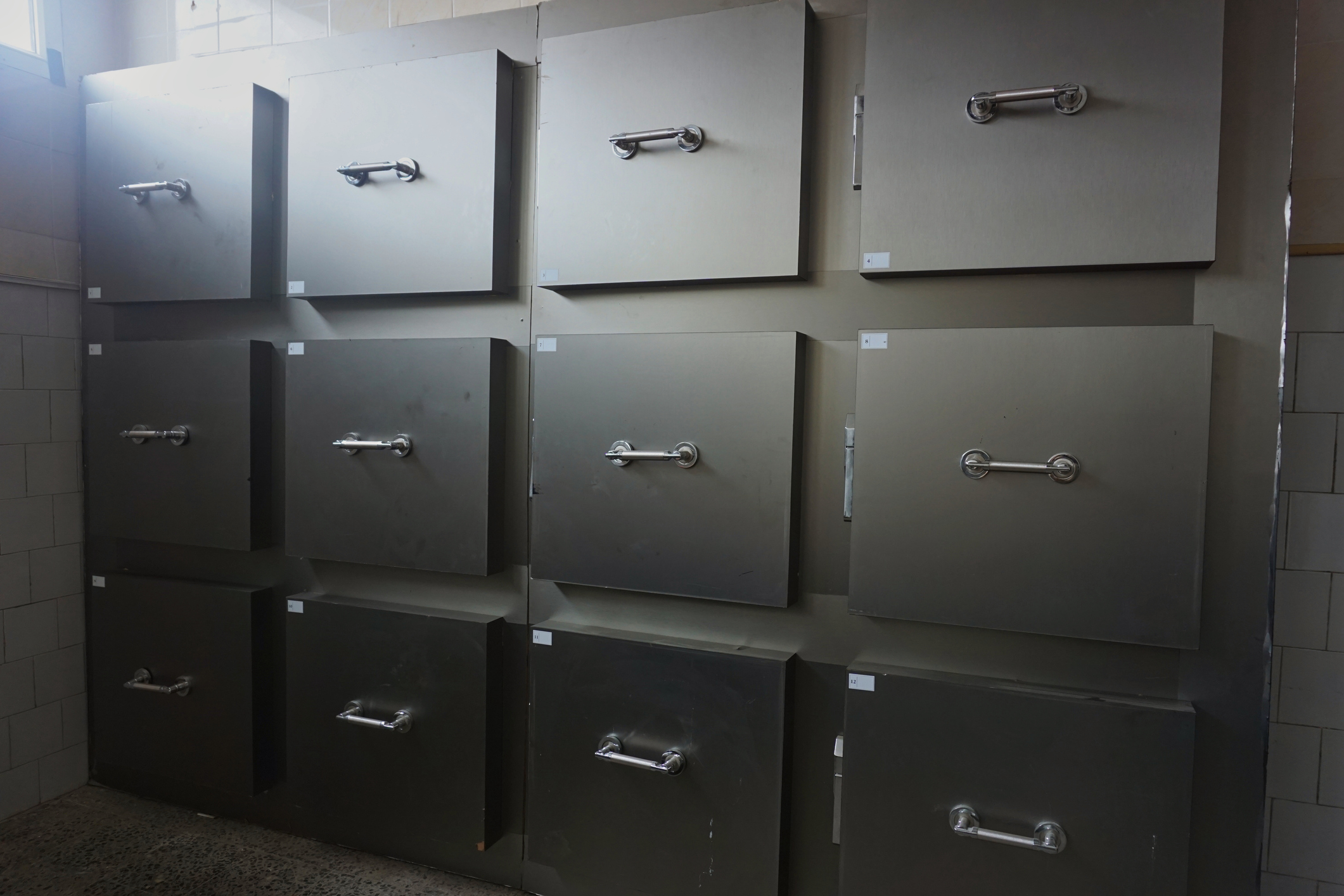 Stainless steel storage cabinets in a mortuary facility